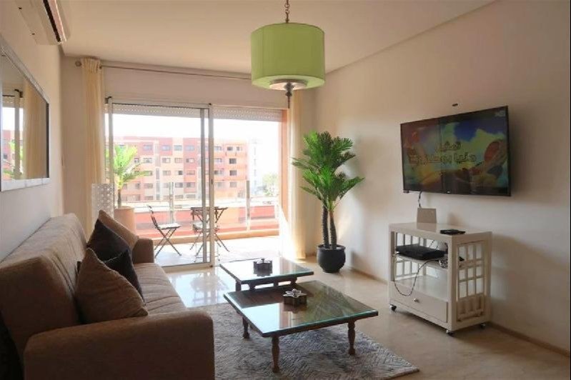 Joli appartement à louer meublé style moderne avec une terrasse situé dans une résidence sécurisée avec piscine à Guéliz