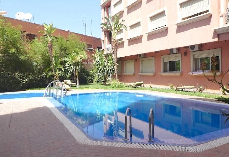 Superbe Appart 3 chambres, 2SDB,  salon cheminée jardins  et piscine dans résidence sécurisée plein Guéliz